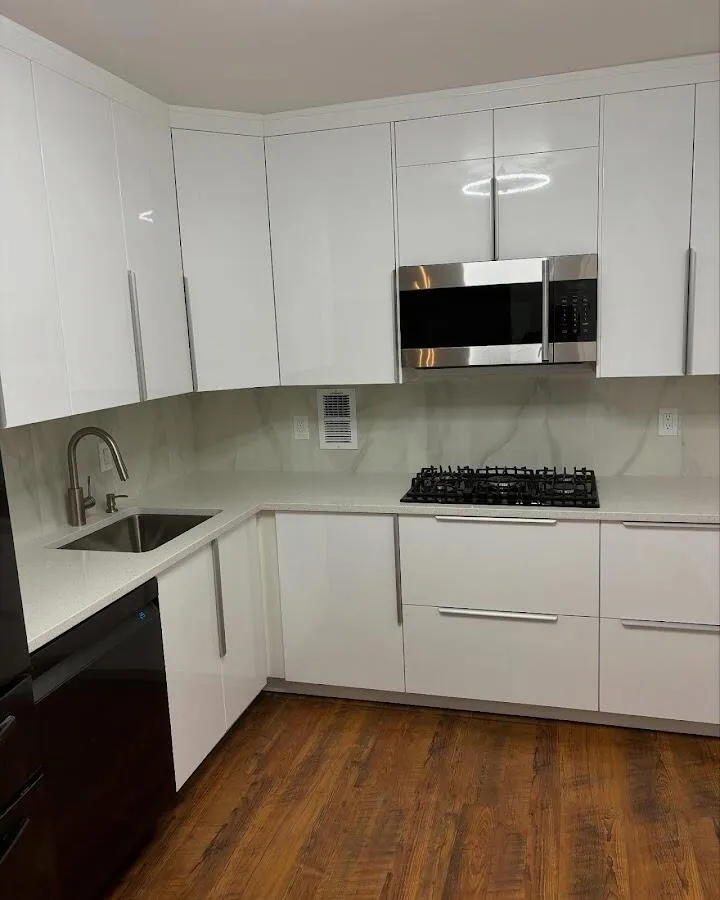 Restored kitchen with white cabinets after water damage in Pelham
